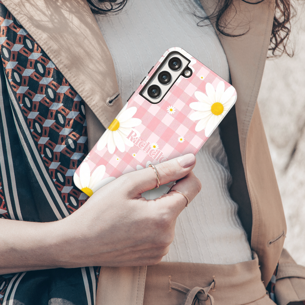 Pink gingham daisy Samsung Galaxy phone case with personalized name. Cute and aesthetic protective cover for Galaxy S25 Ultra, S24 FE, S23, and more.