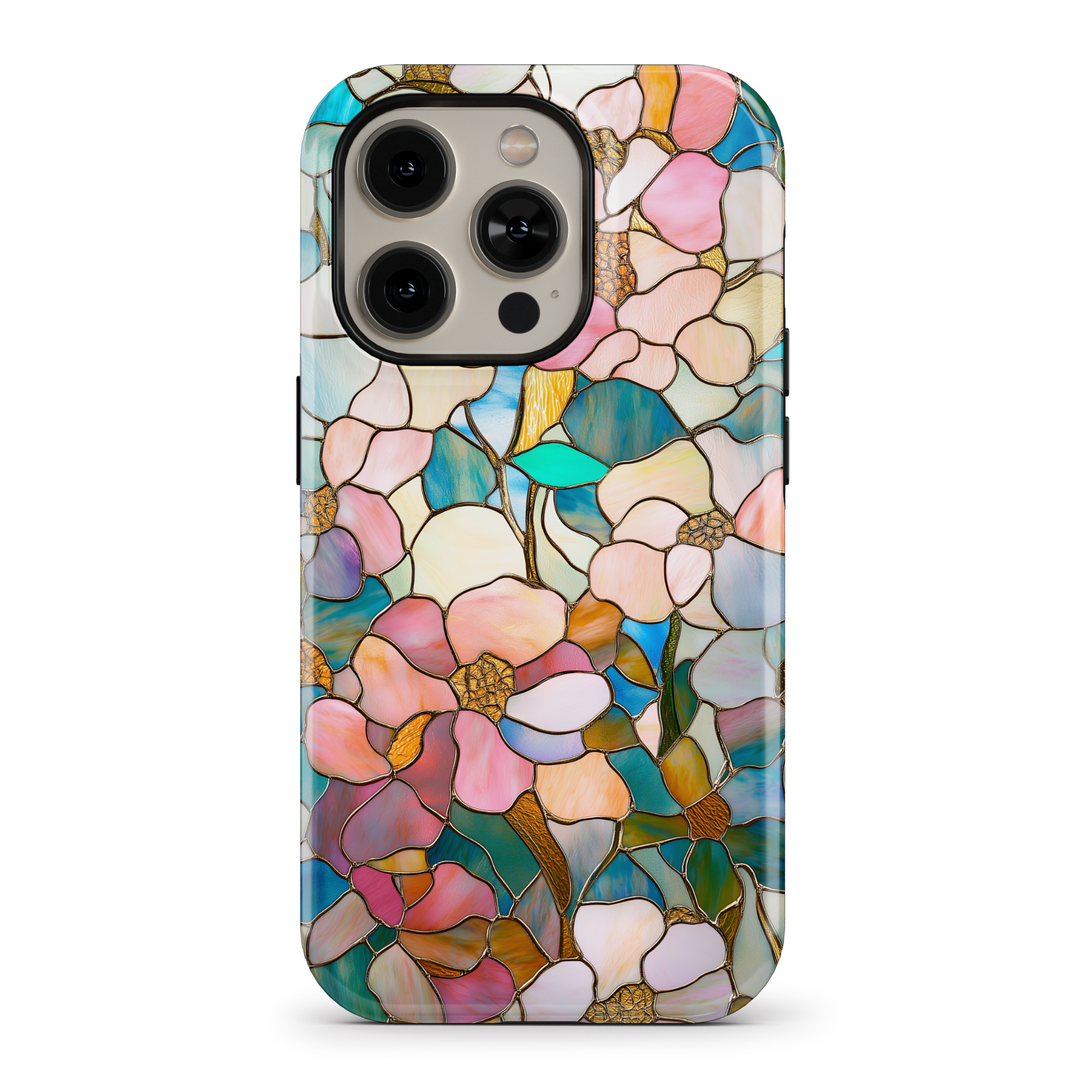 Elegant stained glass floral phone case with intricate flower and leaf patterns in vibrant colors. Offers a protective, tough casing for iPhone SE, iPhone 14 Pro, and iPhone 15 MagSafe. Perfect for women looking for a stylish, nature-inspired design with an artistic touch.