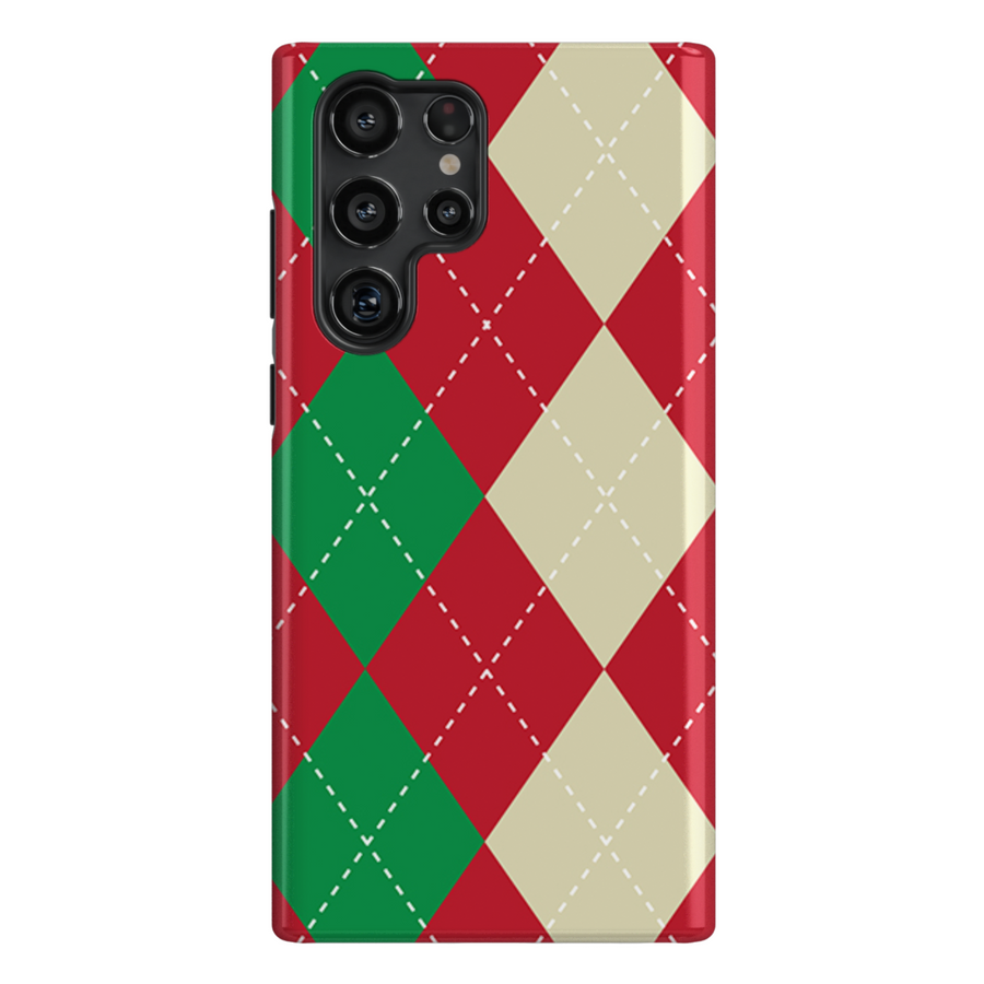 Christmas-themed phone case featuring festive argyle pattern in red, green, and cream colors, with a cute decorative Christmas tree icon. Perfect holiday accessory for iPhone 16 Pro Max, blending seasonal charm with stylish protection